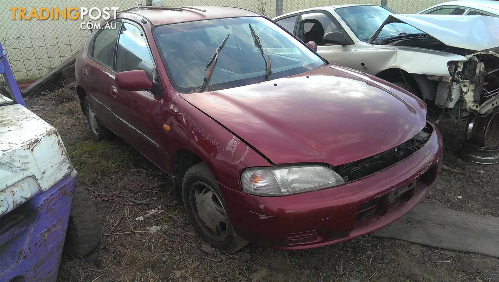 10/94 Ford Laser KJ2 4Dr Hatch Manual 1.8 Petrol LEFT FRONT DOOR TRIM